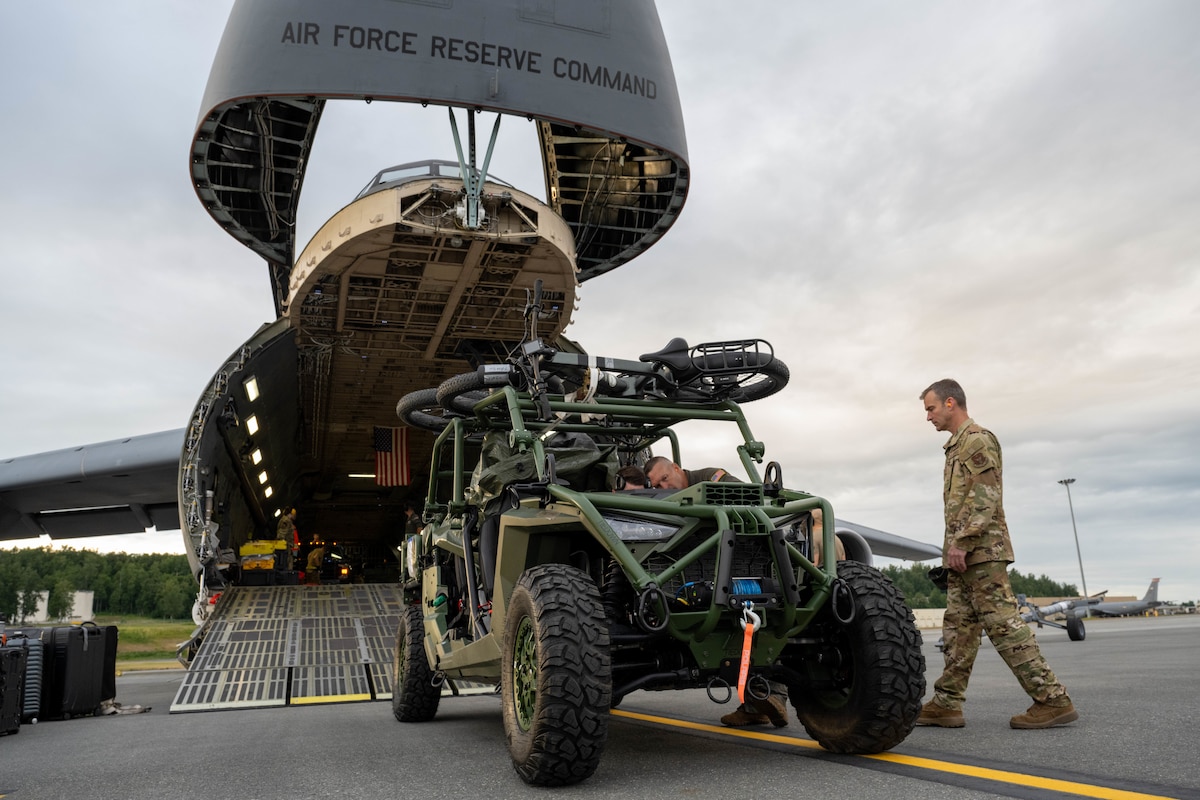 An all-terrain vehicle is loaded onto a C-5M Super Galaxy assigned to the 337th Airlift Squadron, Westover Air Reserve Base, Mass., during exercise Resolute Force Pacific 2025 on Joint Base Elmendorf-Richardson, Alaska, July 13, 2025. The exercise is designed to deliver Air Force capabilities to the Indo-Pacific region at speed and scale, then demonstrate the ability to command and control Agile Combat Employment operations across more than six time zones. (U.S. Air Force photo by Airman 1st Class Owen Davies)