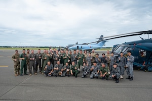 Airmen assigned to the Japan Air Self-Defense Force (JASDF) Air Rescue Wing, the U.S. Air National Guard 102nd Rescue Squadron, and the 130th Rescue Squadron participate in a cross-unit static display and capability exchange in order to strengthen combined capability during exercise Resolute Force Pacific (REFORPAC) 2025 at Misawa Air Base, Japan, July 15, 2025.