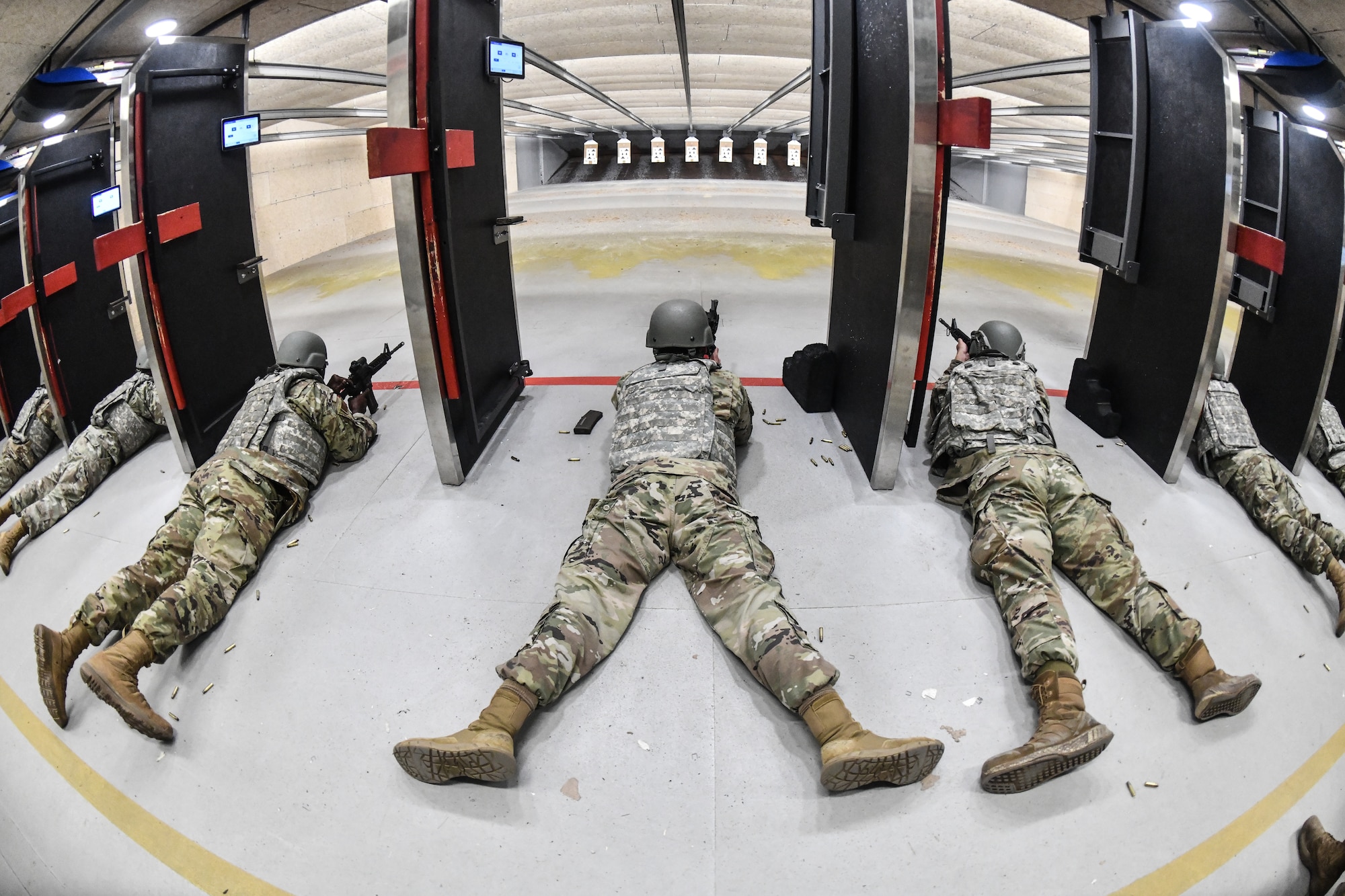 Airmen fire the M-4 rifle in the prone unsupported position at Offutt Air Force Base's combat arms training and maintenance class, June 4, 2025. CATM teaches all Airmen, from those with no weapons experience to those with years of experience, how to correctly and safely use many different types of firearms.(U.S. Air Force photo by Chad Watkins)