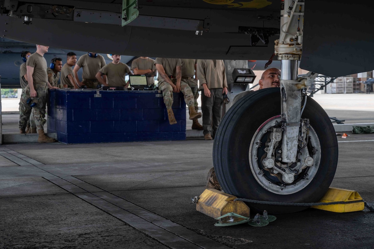 U.S. Air Force Senior Airman Josue Barban, right, 96th Aircraft Maintenance Squadron assistant dedicated crew chief, conducts post flight checks on an F-15EX Eagle II assigned to the 85th Test and Evaluation Squadron, Eglin Air Force Base, Florida, at Kadena Air Base, Japan, July 16, 2025.