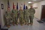 250718-N-VL857-1203 WILLIAMSBURG, Va. (July 18, 2025) Senior leaders from Naval Medical Forces Atlantic pause for a photo during a visit to Naval Medical Readiness Logistics Command, Williamsburg, Virginia. The visit highlighted NMRLC’s role in supporting Navy Medicine’s global logistics mission and expeditionary medical readiness. Pictured left to right, Capt. Chad McKenzie, Deputy Commander, Naval Medical Forces Atlantic (NMFL), Capt. Sue Fierros, NMFL Chief Nursing Officer, and Cmdr. Joe Fromknecht, NMFL Director Maritime Headquarters, Manpower/Personnel. NMRLC's commanding officer Capt. Christopher Barnes and NMRLC executive officer Cmdr. Olusegun Olabode are also pictured.