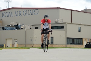 Master Sgt. Jason Smith, 185th Air Refueling Wing Inspector General Office Inspection Coordinator, rides his bicycle