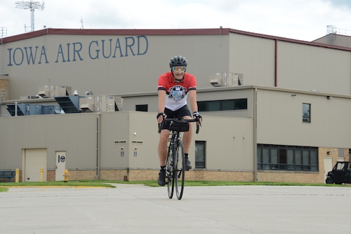 Master Sgt. Jason Smith, 185th Air Refueling Wing Inspector General Office Inspection Coordinator, rides his bicycle