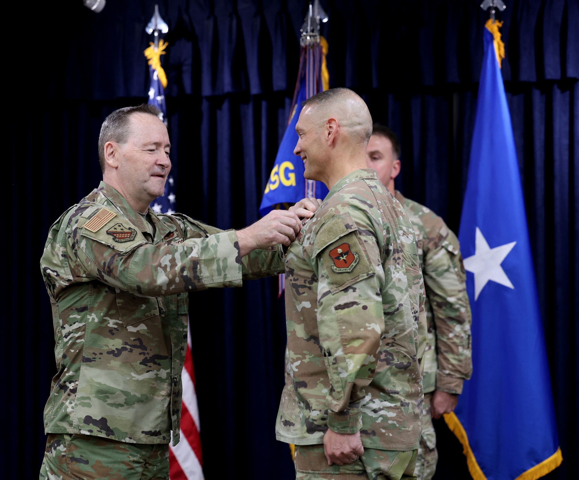 Col. John Hollister receives the Legion of Merit during a change of command ceremony