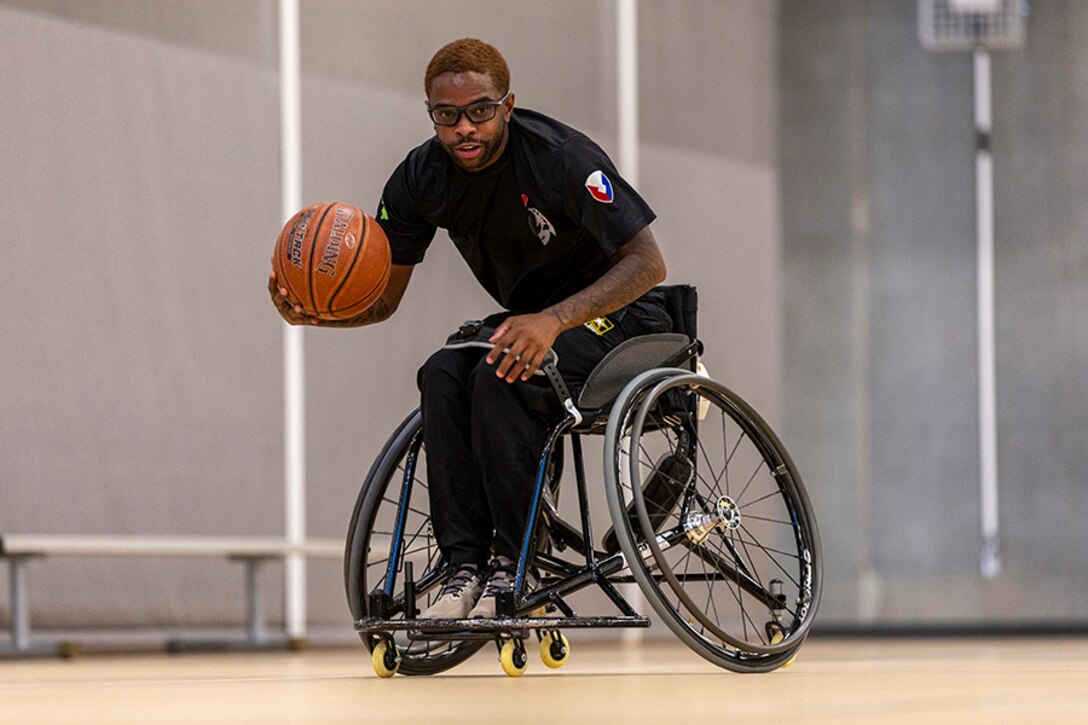 U.S. Army Staff Sgt. Allaijah Churchwell conducts drills at wheelchair basketball practice during the 2025 Department of Defense Warrior Games practice sessions at Fort Carson, Colorado, July 14, 2025.