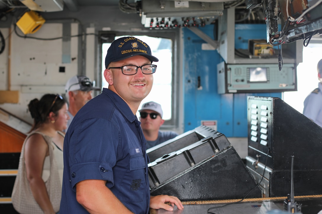 Seaman Alan Rodts, a crew member assigned to Coast Guard Cutter Reliance (WMEC 615), smiles for the camera during public tours of the cutter in Galveston, Texas, July 4, 2025. Reliance’s crew completed a 60-day maritime border security patrol in the Gulf of America to deter illegal migration, fishing, and smuggling in the region. (U.S. Coast Guard photo by Ensign Sarah Kaleta)