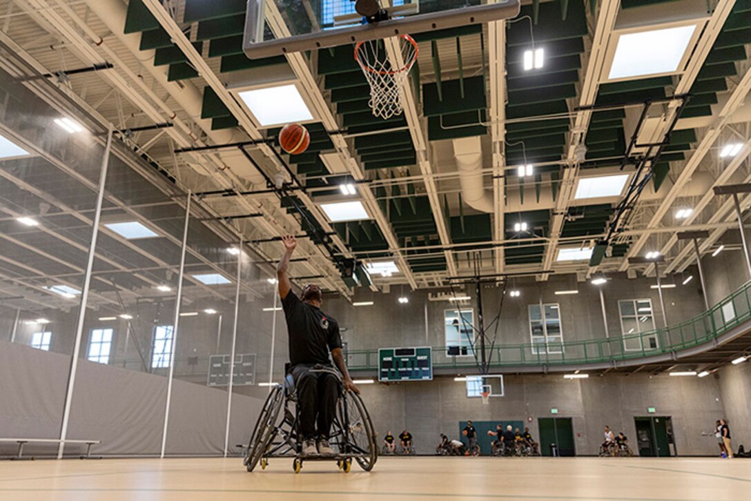 U.S. Army Staff Sgt. Allaijah Churchwell shoots the ball at wheelchair basketball practice during the 2025 Department of Defense Warrior Games practice sessions at Fort Carson, Colorado, July 14, 2025.