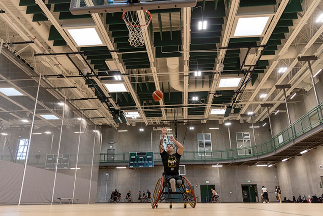 U.S. Army veteran J.P. Lane shoots the ball at the wheelchair basketball practice during the 2025 Department of Defense Warrior Games practice sessions at Fort Carson, Colorado, July 14, 2025.