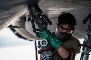 U.S. Air Force Airman 1st Class Joel Velez, 9th Bomber Generation Squadron crew chief, connects a fuel hose to a B-1B Lancer at Dyess Air Force Base, Texas, July 8, 2025. Upgrades to Dyess’ fueling system added 21 new refueling locations, including two additional hot pit refueling stations, enhancing the 7th Bomb Wing’s ability to support B-1 operations. (U.S. Air Force photo by Airman 1st Class Adrien Tran)