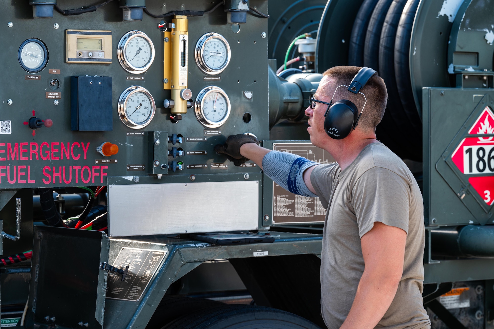 U.S. Air Force Senior Airman Jerry Moore, 7th Logistics Readiness Squadron fuels distribution operator, monitors gauges on an R-12 hydrant refueling truck during a hot pit refuel at Dyess Air Force Base, Texas, July 8, 2025. The 7th Bomb Wing is in the final phase of a four-year project to modernize its primary fueling system –doubling refueling capacity and enhancing mission readiness across the base. (U.S. Air Force photo by Airman 1st Class Adrien Tran)