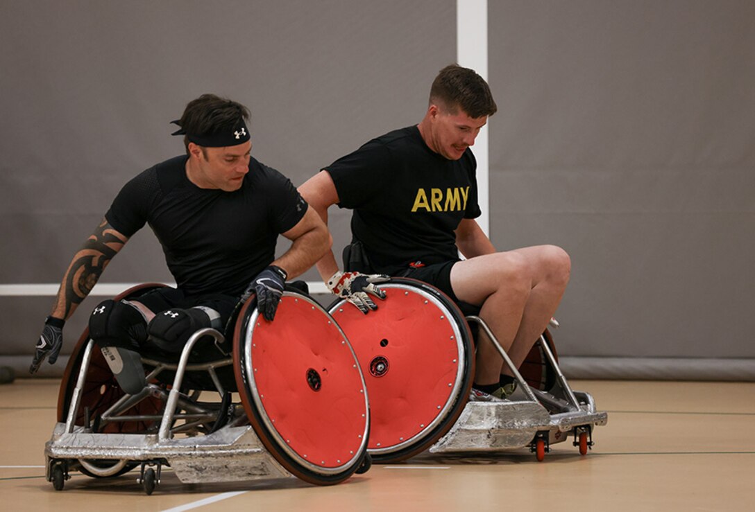 U.S. Army veteran J.P. Lane, left, and Staff Sgt. Coty Tuck conduct drills at wheelchair rugby practice during the 2025 Department of Defense Warrior Games practice sessions at Fort Carson, Colorado, July 14, 2025.