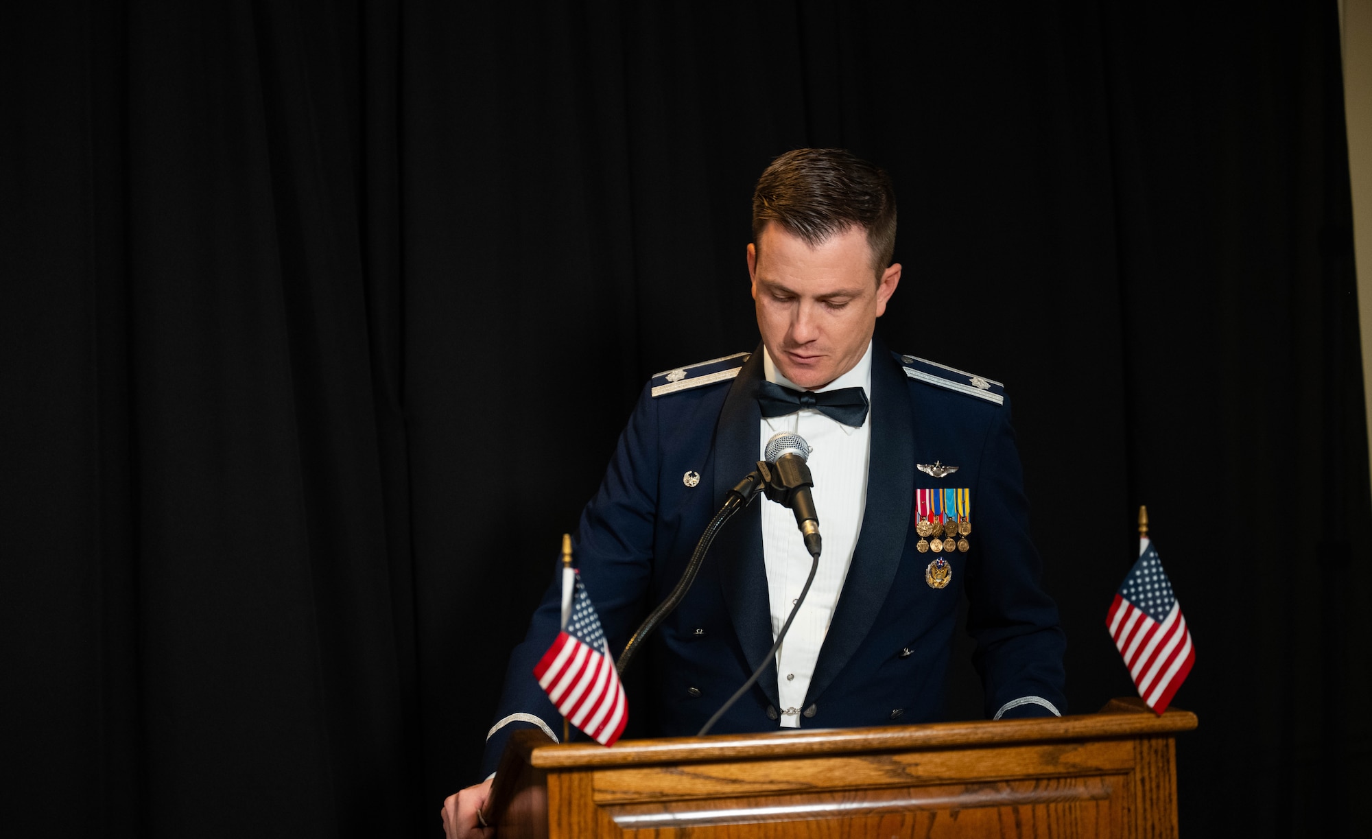 U.S. Air Force Lt. Col. Bendel Rushing, 434th Flying Training Squadron commander, speaks at the graduation of class 25-12 at Laughlin Air Force Base, Texas, July 18, 2025.  28 student pilots were recognized for their successful completion of undergraduate pilot training. (U.S. Air Force photo by Airman 1st Class Darryl Keith.)
