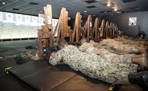 U.S. service members participate in M4 Carbine qualification during electronic simulation training hosted by the U.S. Army Support Activity, Fort Dix as part of the Leading Edge course at Joint Base McGuire-Dix-Lakehurst, N.J., June 26, 2025. Leading Edge is a biannual joint operation training course offered to service members between the ranks of E-4 to E-6 from all military branches to enhance leadership, interoperability, and understanding of each service’s capabilities. (U.S. Air Force photo by Susan Moriarty)