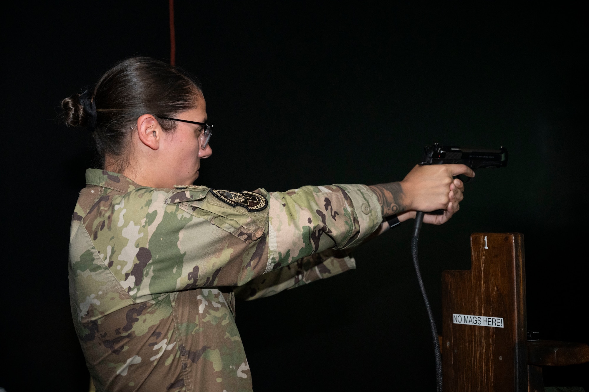U.S. Air Force Tech. Sgt. Makenna Cozza, 87th Medical Group paramedic, uses a training Beretta M9 handgun during electronic simulation training hosted by U.S. Army Support Activity, Fort Dix as part of the Leading Edge course at Joint Base McGuire-Dix-Lakehurst, N.J., June 26, 2025.