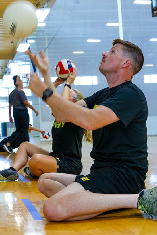 U.S. Army Staff Sgt. Coty Tuck practices volleying the ball at seated volleyball practice during the 2025 Department of Defense Warrior Games practice sessions at Fort Carson, Colorado, July 13, 2025.