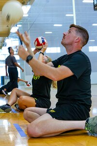U.S. Army Staff Sgt. Coty Tuck practices volleying the ball at seated volleyball practice during the 2025 Department of Defense Warrior Games practice sessions at Fort Carson, Colorado, July 13, 2025.