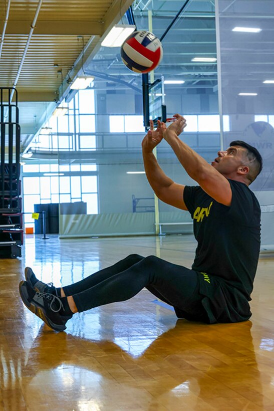 U.S. Army Sgt. 1st Class Alberto Alvarez practices volleying the ball at seated volleyball practice during the 2025 Department of Defense Warrior Games practice sessions at Fort Carson, Colorado, July 13, 2025.