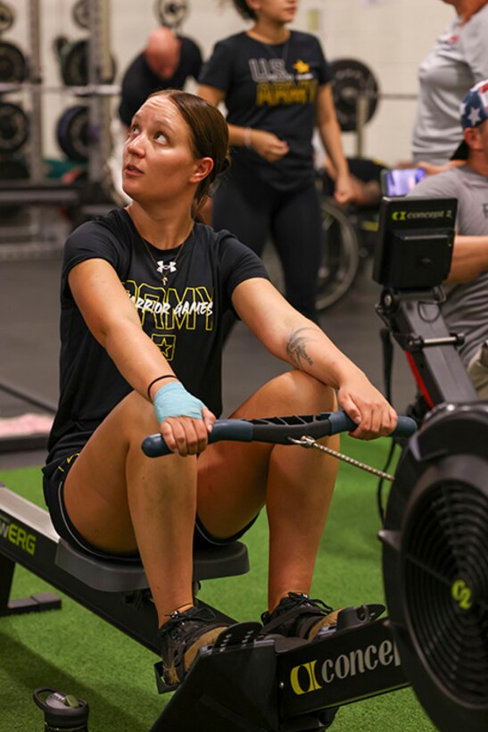 U.S. Army Spc. Avery Short receives instructions from a coach at indoor rowing practice during the 2025 Department of Defense Warrior Games practice sessions at Fort Carson, Colorado, July 13, 2025.