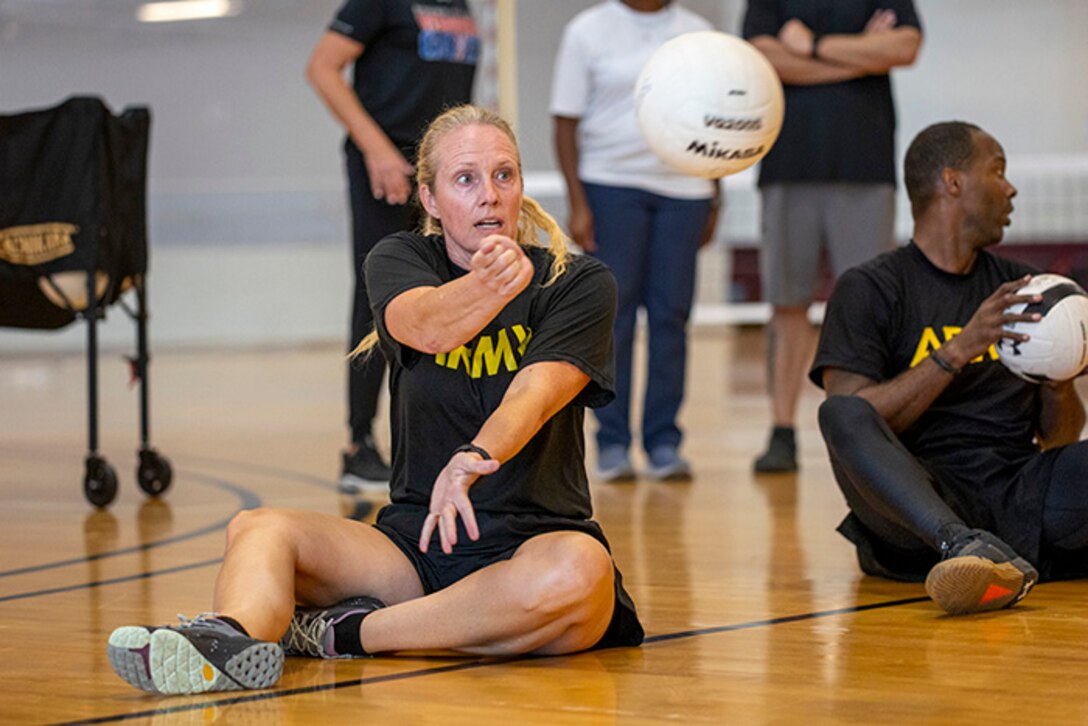U.S. Army Maj. Amy Sparks conducts drills at sitting volleyball practice during the 2025 Department of Defense Warrior Games at Fort Carson, Colorado, July 13, 2025.
