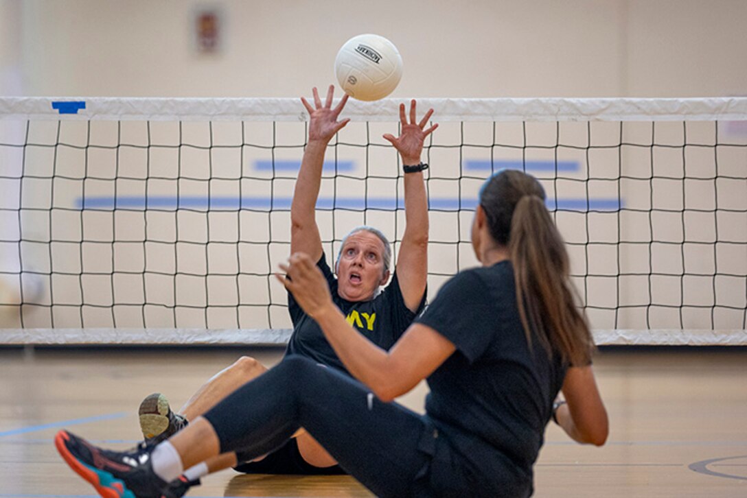 U.S. Army Maj. Amy Sparks hits the ball while conducting drills at sitting volleyball practice during the 2025 Department of Defense Warrior Games at Fort Carson, Colorado, July 13, 2025.