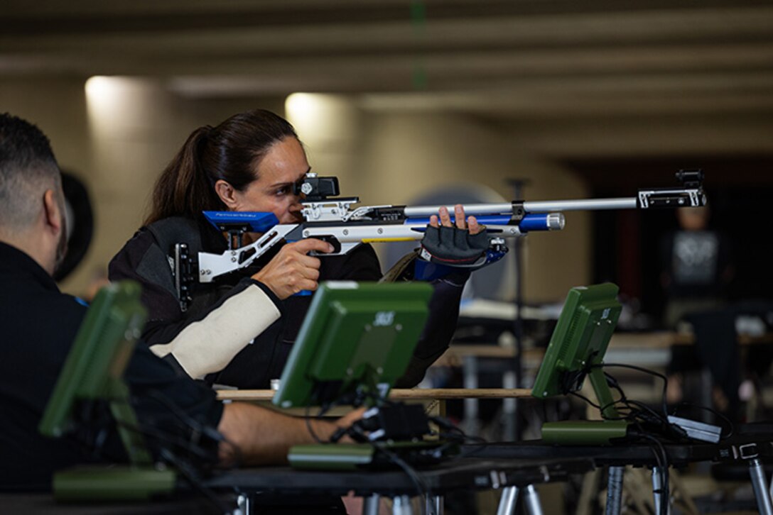 U.S. Army Lt. Col. Sherri Sanders prepares to fire an air rifle at precision air practice during the 2025 Department of Defense Warrior Games at Fort Carson, Colorado, July 13, 2025.