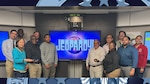Group of people pose for photo.