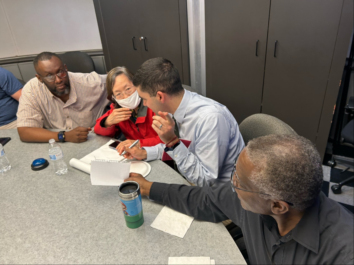 People discuss answer during game.