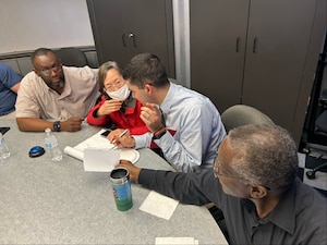 People discuss answer during game.