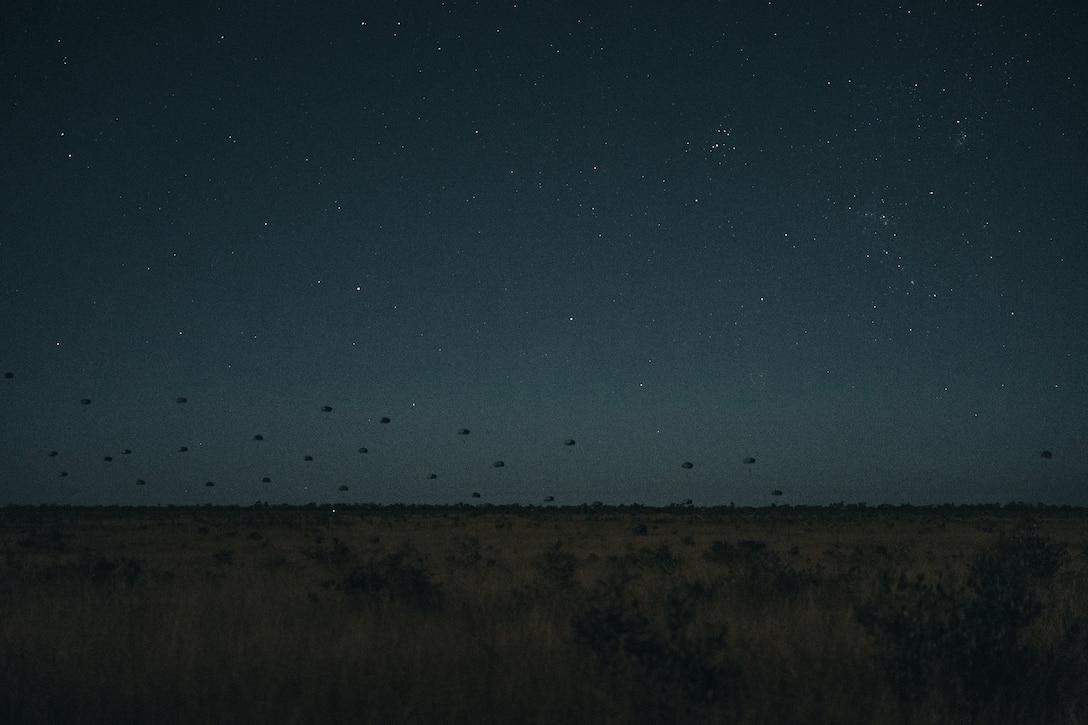 Paratroopers from the United States Army, French Armed Forces and German Army conduct an airborne insertion at night into the Charters Towers region, during Exercise Talisman Sabre. Talisman Sabre is the largest bilateral military exercise between Australia and the United States advancing a free and open Asia-Pacific by strengthening relationships and interoperability among key allies and partners, while enhancing our collective capabilities to respond to a wide array of potential security concerns.