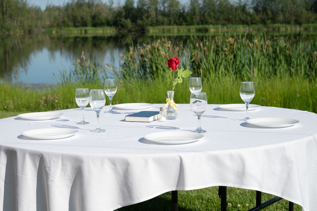 A table for the U.S. military prisoners-of-war and those missing-in-action stands in remembrance during a change of command ceremony at Eielson Air Force Base, Alaska, July 18, 2025.