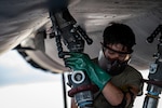 U.S. Air Force Airman 1st Class Joel Velez, 9th Bomber Generation Squadron crew chief, connects a fuel hose to a B-1B Lancer at Dyess Air Force Base, Texas, July 8, 2025. Upgrades to Dyess’ fueling system added 21 new refueling locations, including two additional hot pit refueling stations, enhancing the 7th Bomb Wing’s ability to support B-1 operations. (U.S. Air Force photo by Airman 1st Class Adrien Tran)