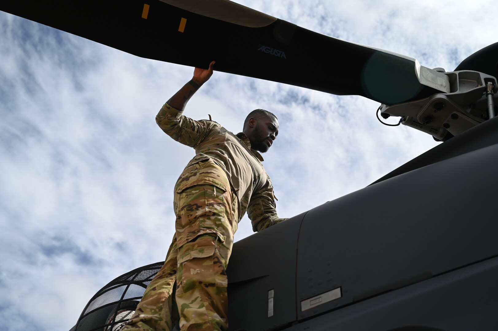 a person rotates a helicopter