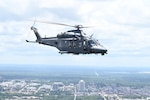 A U.S. Air Force MH-139A Grey Wolf helicopter, from to the 908th Flying Training Wing, flies over Downtown Montgomery, July 17, 2025. The MH-139A can reach heights of more than 20,000 feet. (U.S. Air Force photo by Senior Airman Kamiyah Burks)