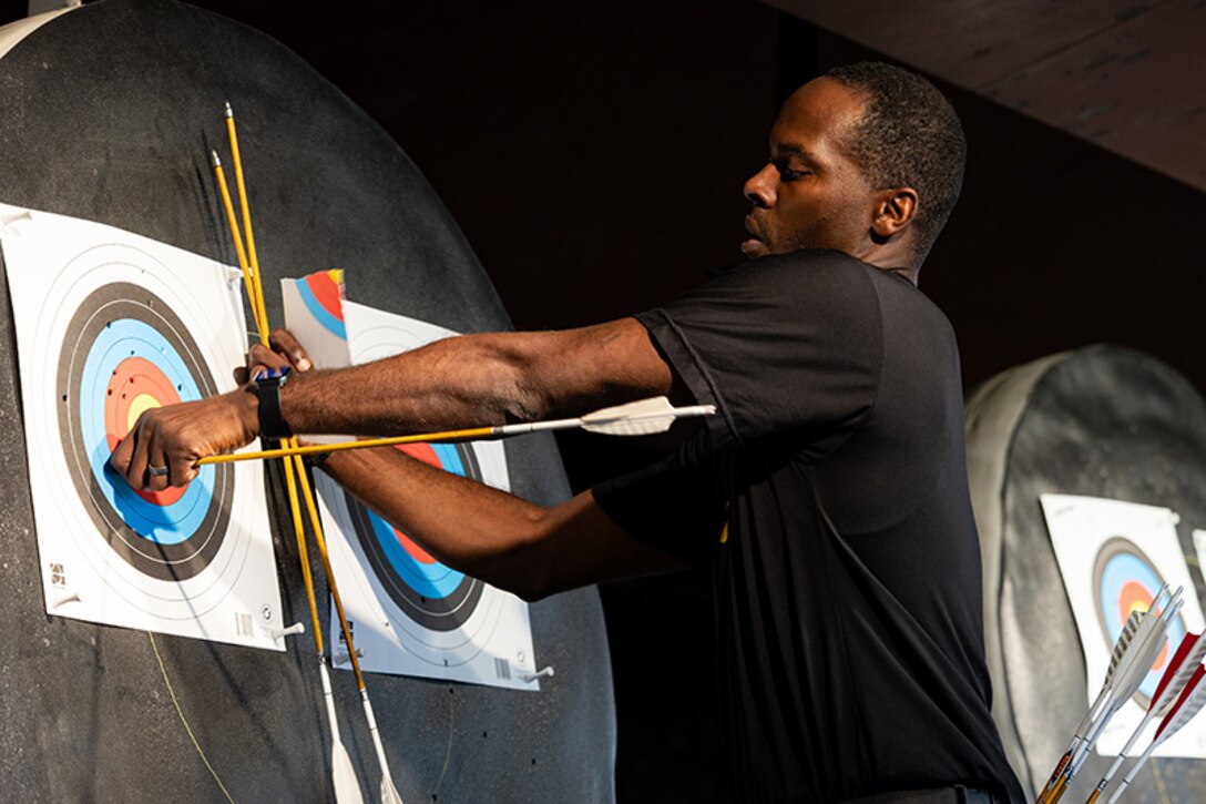 U.S. Army Staff Sgt. Derrick Thompson retrieves his arrows at archery practice during the 2025 Department of Defense Warrior Games at Fort Carson, Colorado, July 13, 2025.