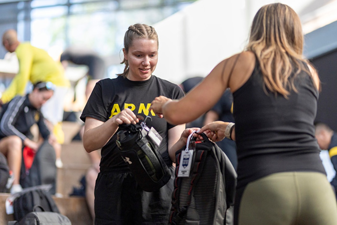 U.S. Army Capt. Samantha Frey receives her Team Army gear for the 2025 Department of Defense Warrior Games at Colorado Springs, Colorado, July 15, 2025.