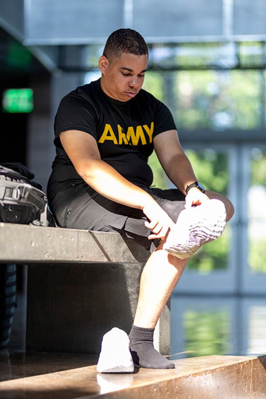 U.S. Army Pfc. Colby Maury-Rice tries on his new shoes at the Team Army uniform issue during the 2025 Department of Defense Warrior Games at Colorado Springs, Colorado, July 15, 2025.
