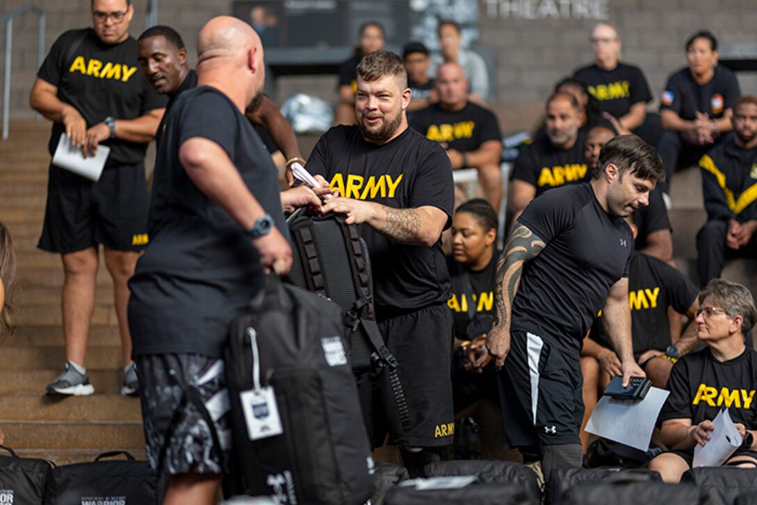 U.S. Army Sgt. 1st Class Adam Proctor receives his Team Army gear at the 2025 Department of Defense Warrior Games at Colorado Springs, Colorado, July 15, 2025.