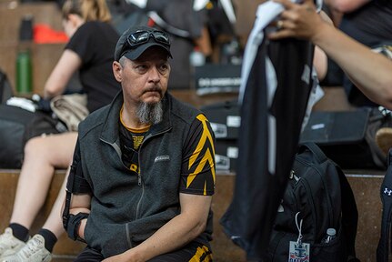 Retired U.S. Army Maj. Jeremy Ditlevson checks out part of his new Team Army uniform during the 2025 Department of Defense Warrior Games at Colorado Springs, Colorado, July 15, 2025.