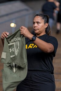 U.S. Army Staff Sgt. Mercedes Rangel looks through her Team Army issued gear for the 2025 Department of Defense Warrior Games at Colorado Springs, Colorado, July 15, 2025.