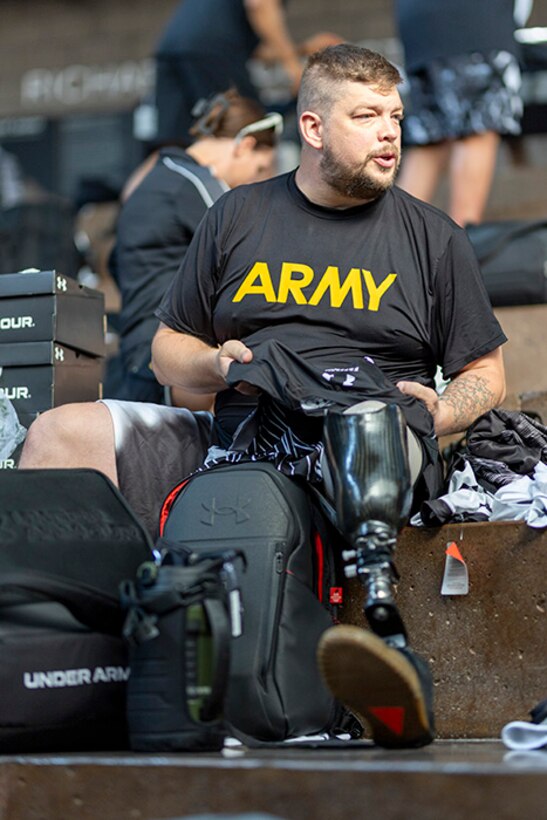 U.S. Army Sgt. 1st Class Adam Proctor looks through his Team Army issued gear for the 2025 Department of Defense Warrior Games at Colorado Springs, Colorado, July 15, 2025.