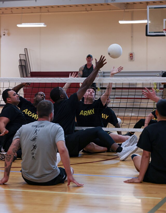 Team Army athletes participate in sitting volleyball practice during the 2025 Department of Defense Warrior Games training camp at Fort Carson, Colorado, July 15, 2025.