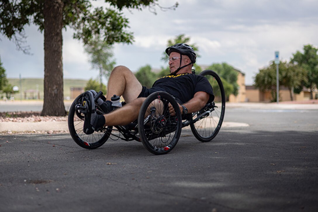 U.S. Army 1st Sgt. Christopher Morago takes a sharp turn on a recumbent bike at cycling practice during the 2025 Department of Defense Warrior Games training camp at Fort Carson, Colorado, July 15, 2025.