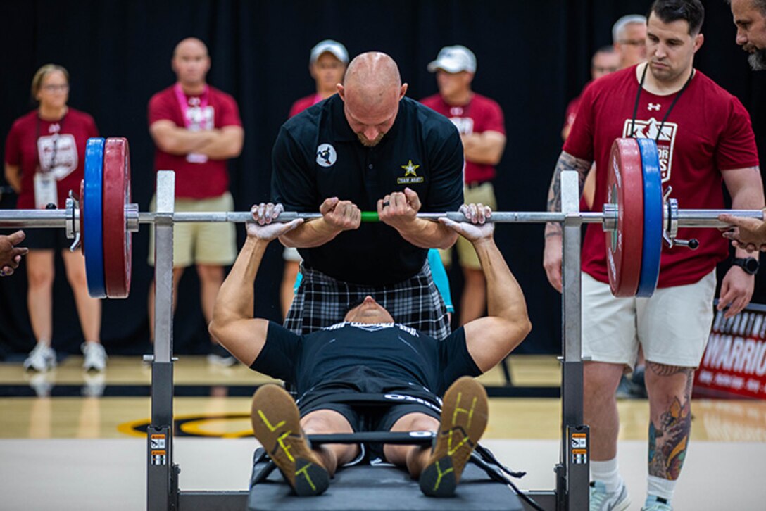 U.S. Army Sgt. 1st Class Alberto Alvarez begins his first rep in the powerlifting event during the 2025 Department of Defense Warrior Games at Reid Arena, Colorado Springs, Colorado, July 18, 2025.