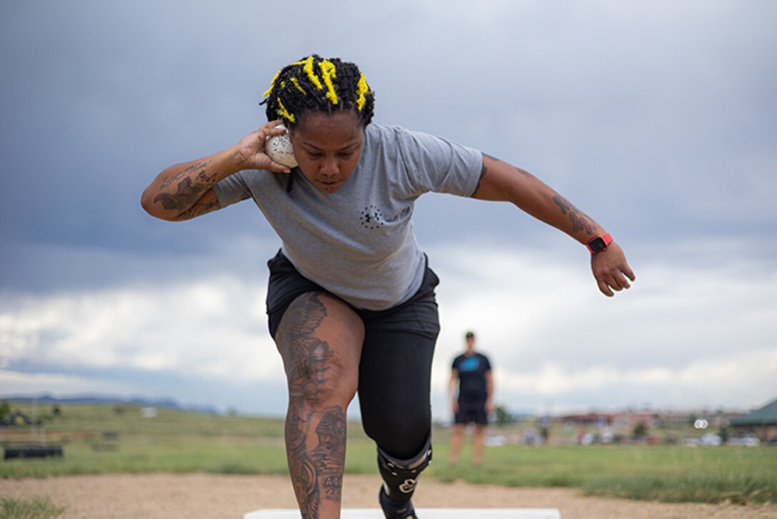 U.S. Army Retired Sgt. 1st Class Valerie Watkins prepares to put a shot at field practice during the 2025 Department of Defense Warrior Games at Fort Carson, Colorado, July 14, 2025.