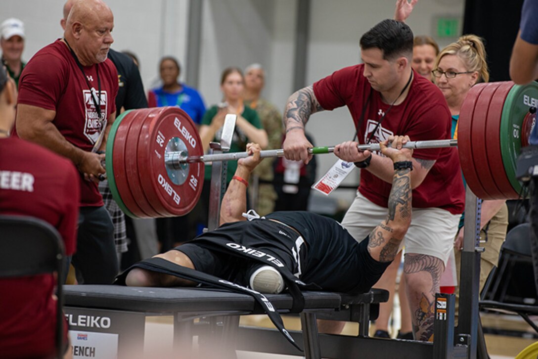 U.S. Army Retired Sgt. Jason Smith pushes his final rep during the 2025 Department of Defense Warrior Games at Reid Arena, Colorado Springs, Colorado, July 18, 2025.