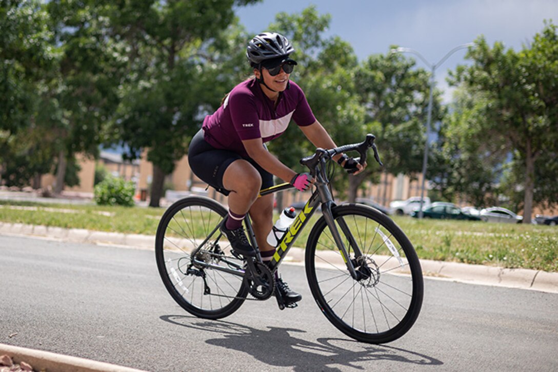U.S. Army Staff Sgt. Mercedes Rangel leans into a turn at cycling training camp during the 2025 Department of Defense Warrior Games training camp at Fort Carson, Colorado, July 15, 2025.