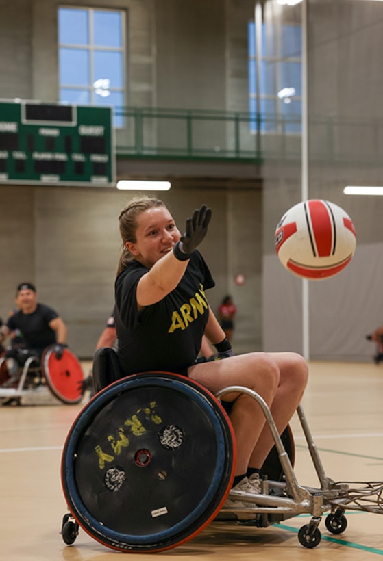 U.S. Army Capt. Samantha Frey reaches for the ball while participating in drills at wheelchair rugby practice during the 2025 Department of Defense Warrior Games training camp at Fort Carson, Colorado, July 14, 2025.
