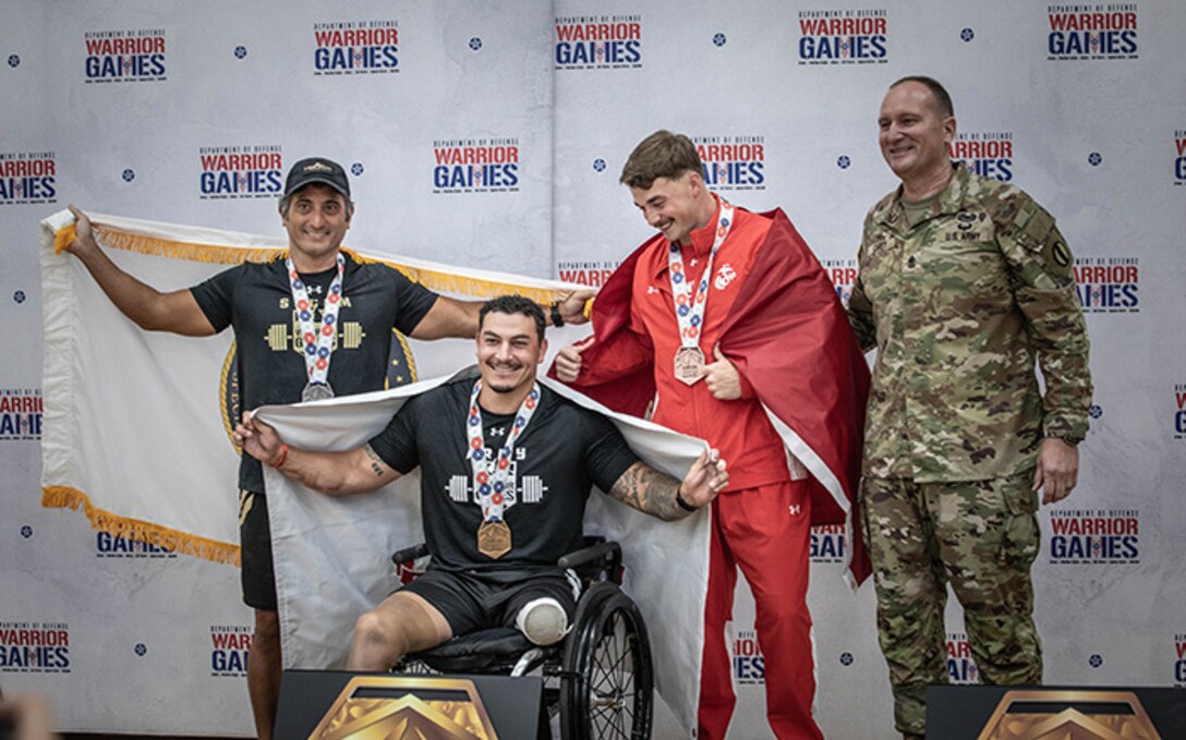 U.S. Army Col. Christopher Leung, left, U.S Army Retired Sgt. Jason Smith, center, U.S. Marine Corps Lance Cpl. Dakota Shaffer, and U.S. Army Sgt. Maj. Christopher Carey, the Deputy Chief of Staff Sergeant Major.