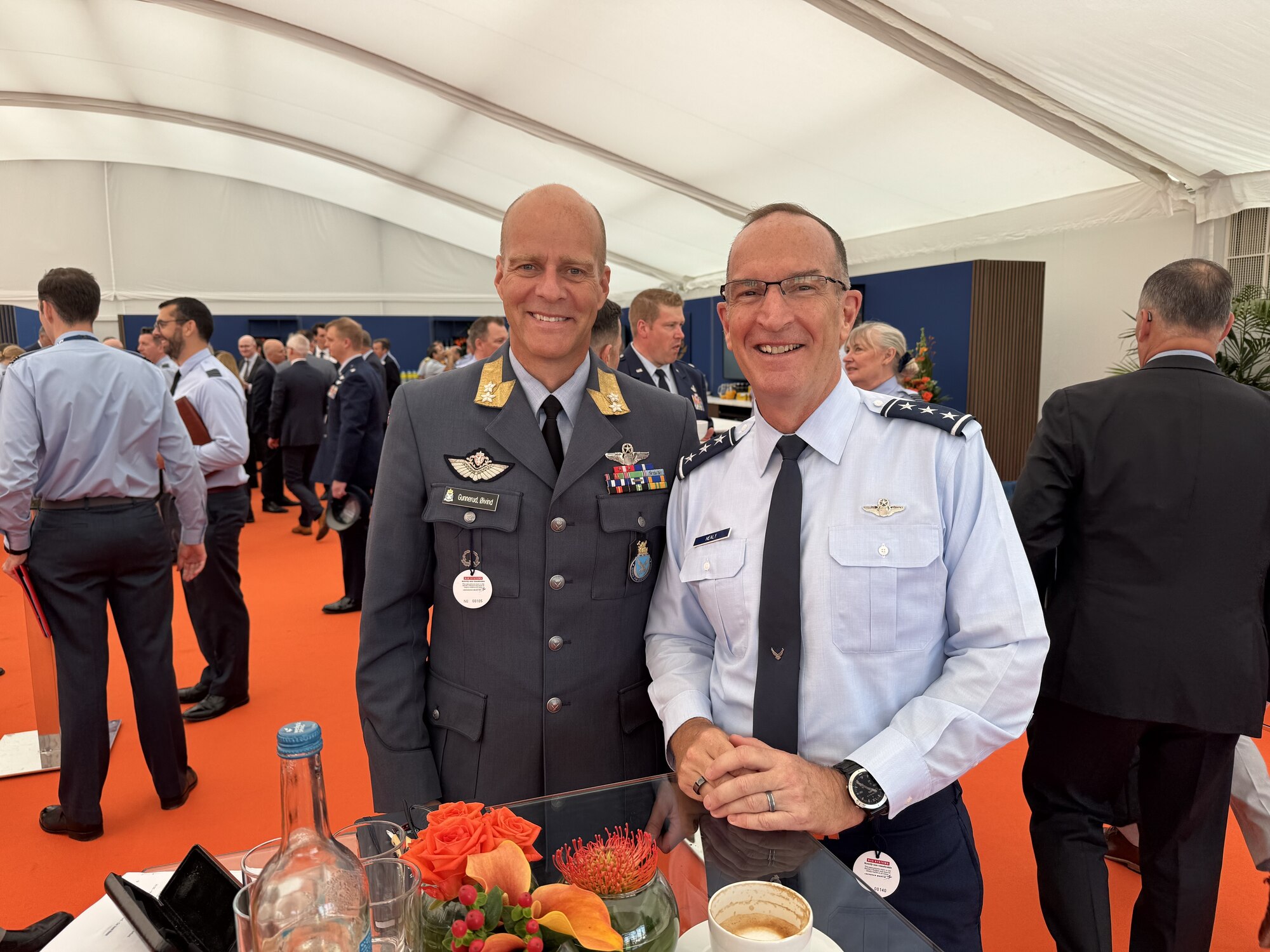 Two men pose for a photo