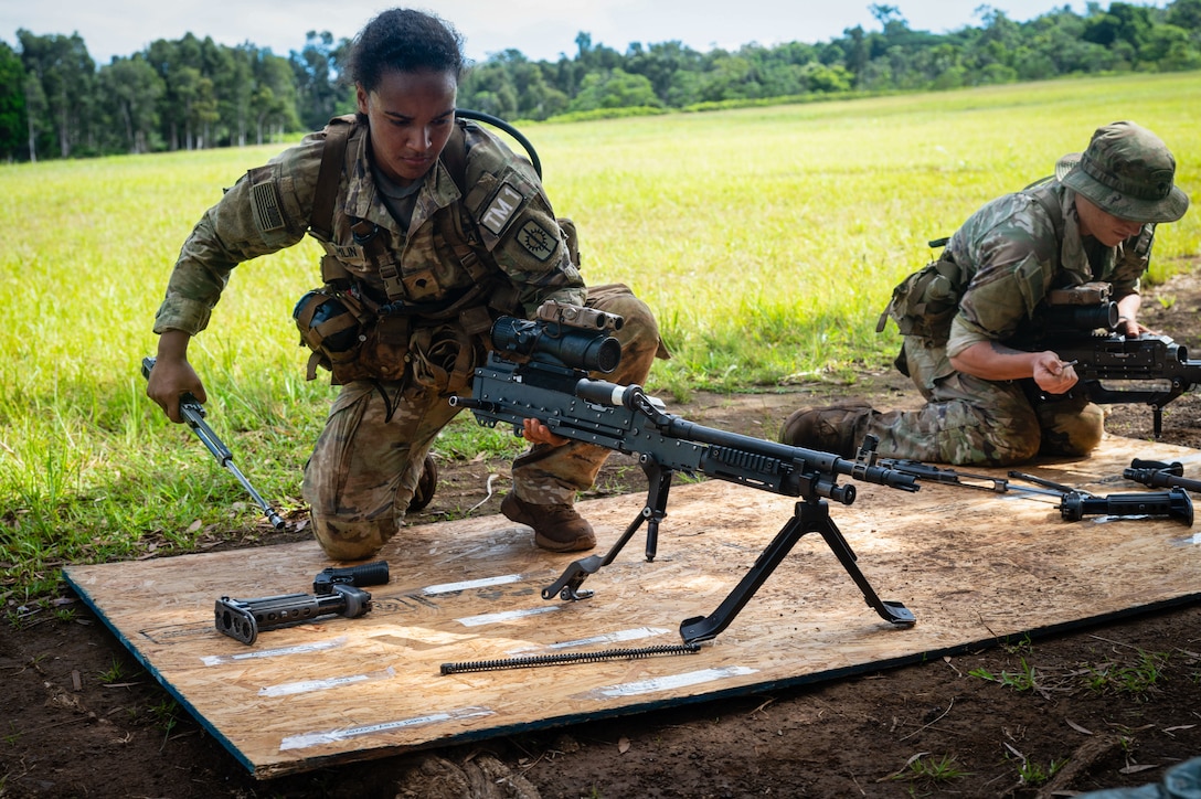 U.S. Army Spc. Olivia Tomlin, 8th Military Police Brigade, disassembles and reassembles weapons during the U.S. Army Pacific Best Squad Competition, July 16, 2025.